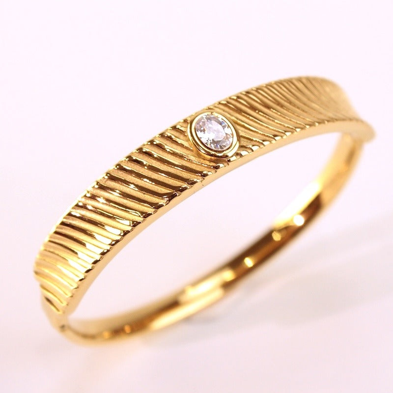 BRAZALETE ACERO CIRCONITA DORADO