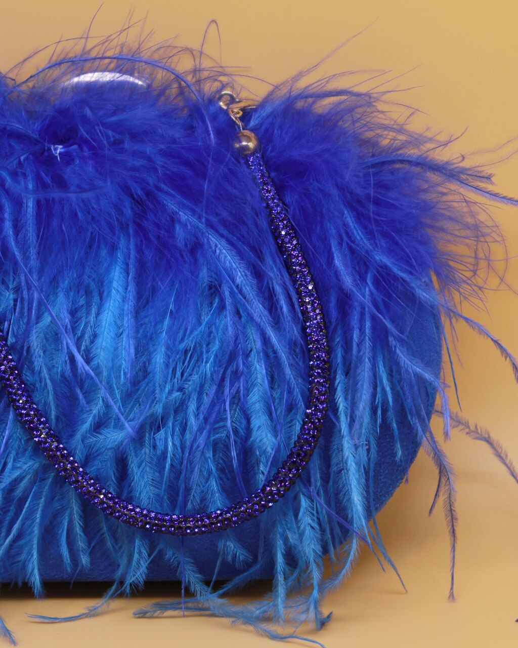BOLSO RIGIDO PLUMAS