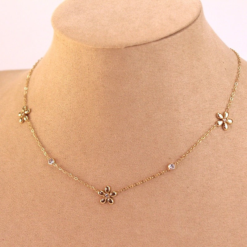 COLLAR ACERO FLORES DORADO